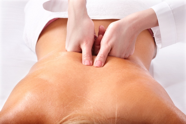 Massage of female back. Spa